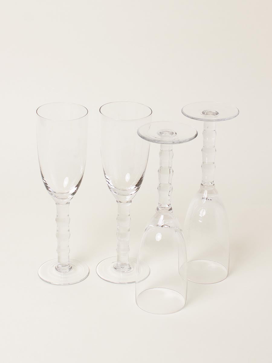 Set of 4 clear ribbed-stem flutes