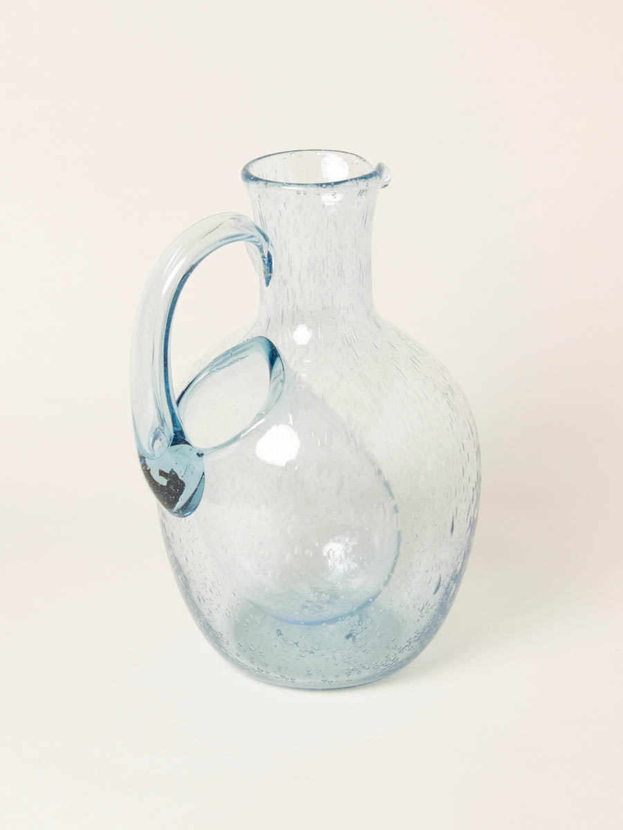 Blue bubble pitcher with ice catch