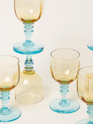 Set of small blue and yellow wine glasses
